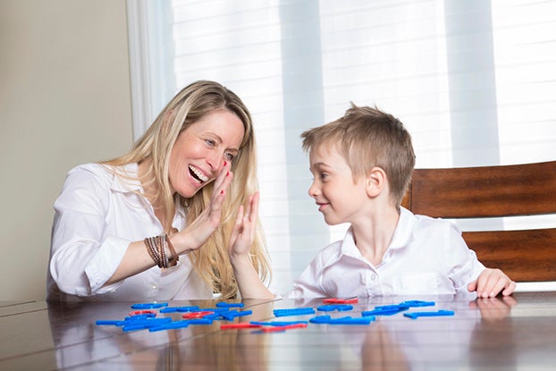 parents playing a phonics game