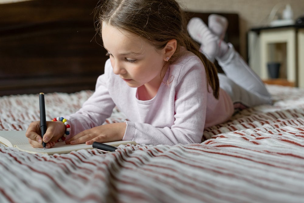 young girl journaling