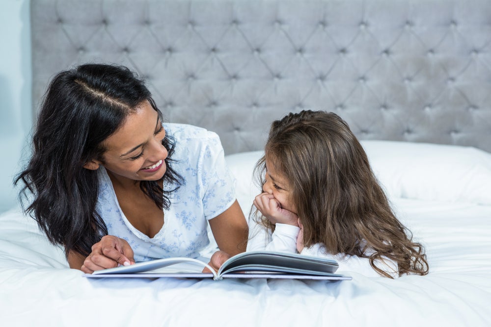 Mom reading to daughter