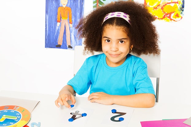 Girl learning first grade math