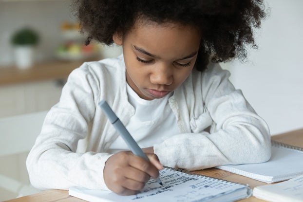 Young girl doing first grade math