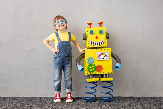 Kid playing with a robot