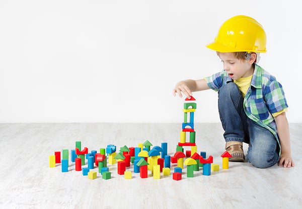 Young kid playing with blocks