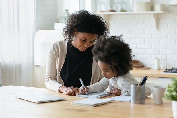 Mom working with daughter on her math skills