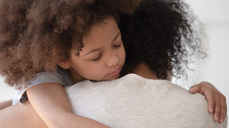 kid hugging parent