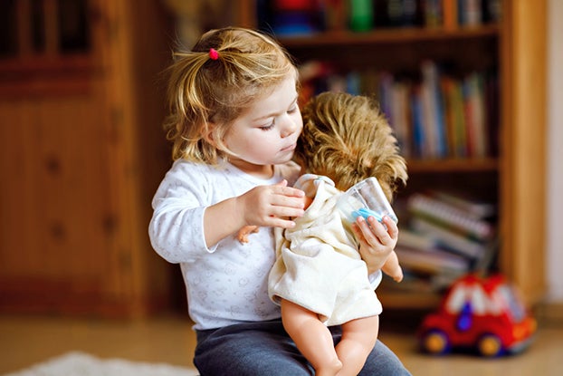 young girl in pretend play 