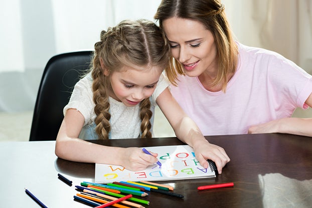 Mom doing a reading program for kids