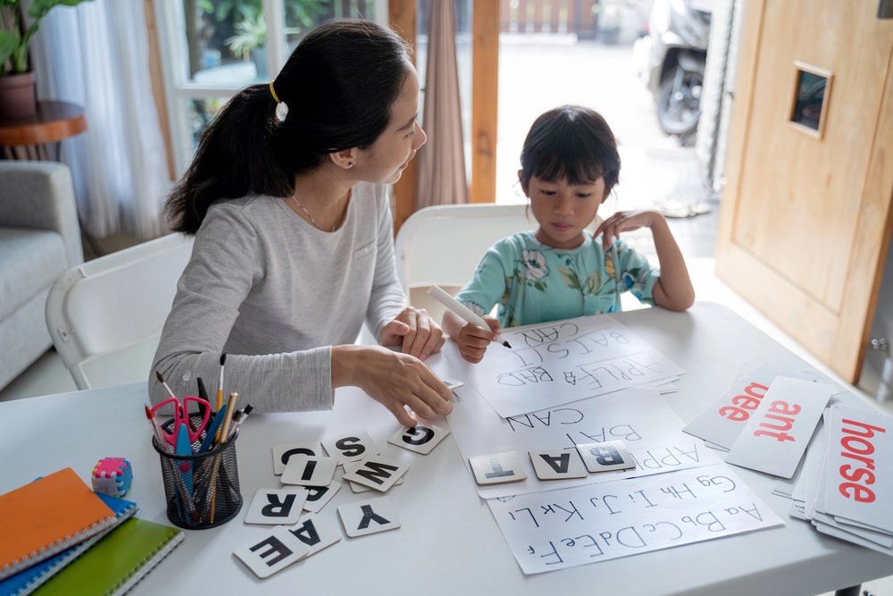 Mom teaching sight words for kindergarten