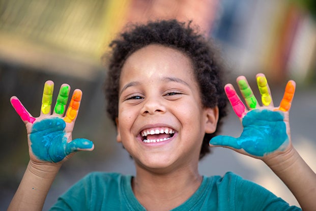 hand painting at first day of preschool
