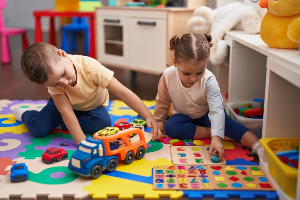 Two kids playing with toys