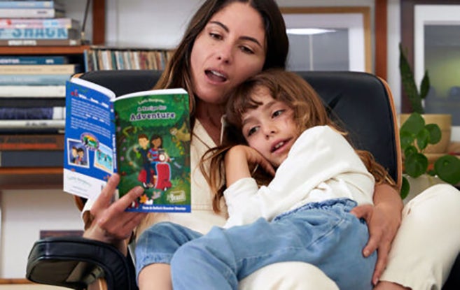 Mom reading to daughter