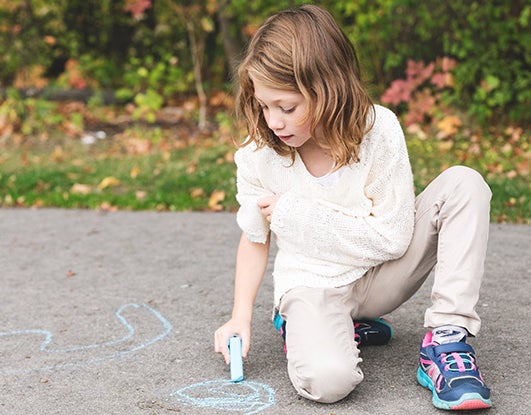 Kid playing with chalk