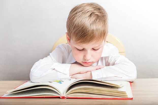 First grader reading a book