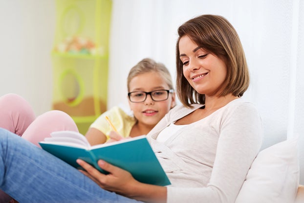 Mom reading aloud to child