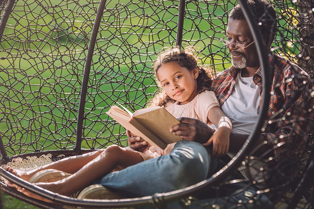 Dad and daughter reading together