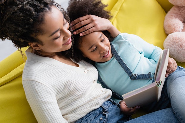 Mom reading with daughter