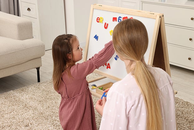 Mom Helping Child Become a Better Speller