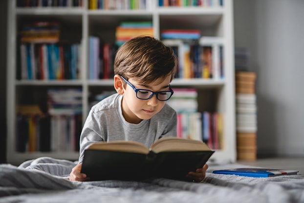 Kid learning the 5 Components of Reading